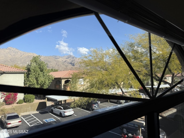 exterior details with a parking lot and a mountain view