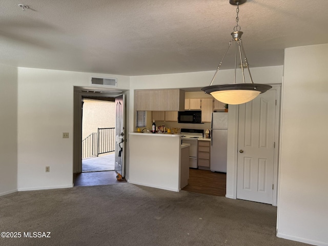 kitchen featuring light brown cabinets, white appliances, visible vents, and dark carpet