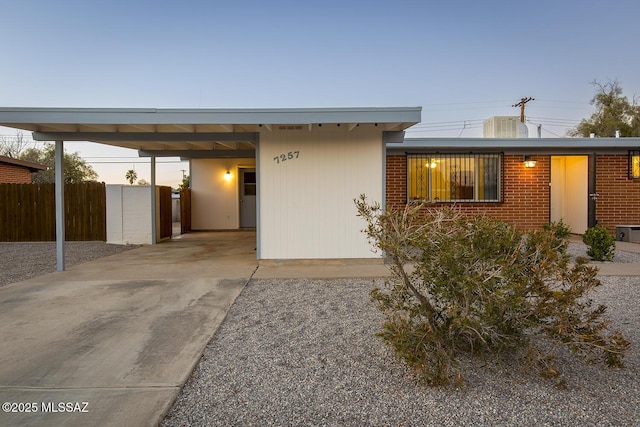 view of front of property featuring a carport