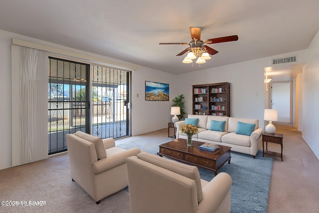 living room with light carpet and ceiling fan