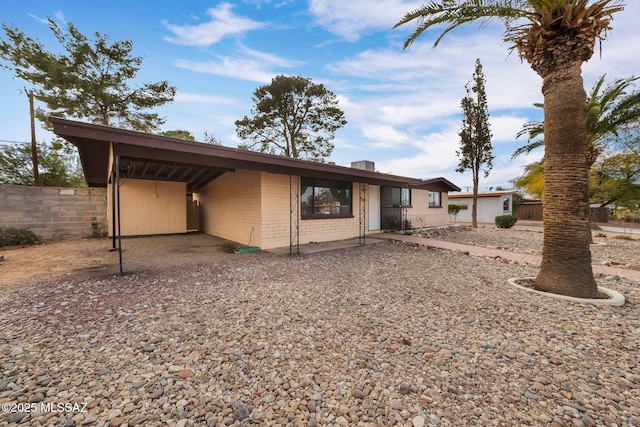 view of front facade with a carport