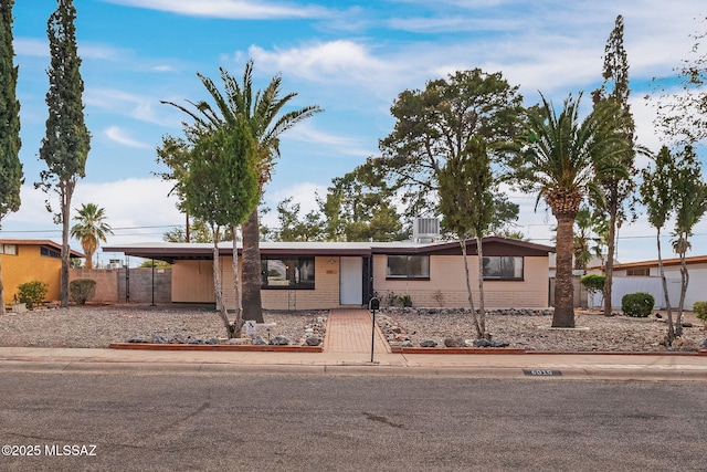 ranch-style home with a carport