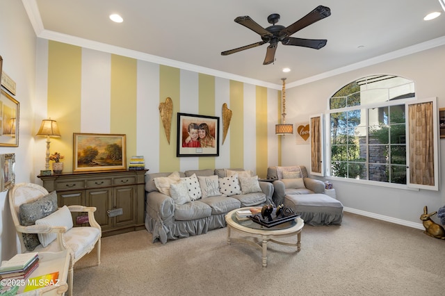 living room with carpet flooring, crown molding, and ceiling fan