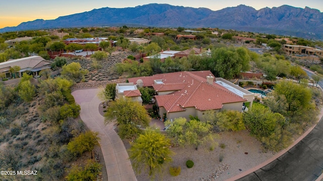 aerial view at dusk with a mountain view