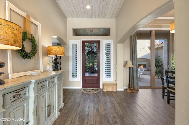 foyer with dark hardwood / wood-style flooring and wooden ceiling