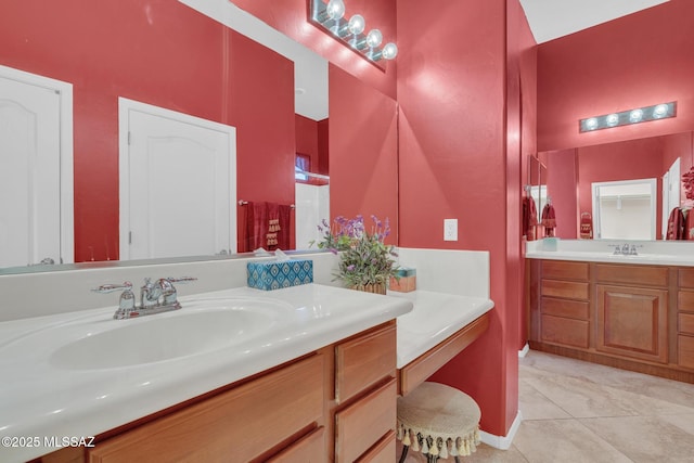 bathroom with tile patterned floors and vanity