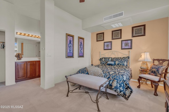 bedroom with light colored carpet