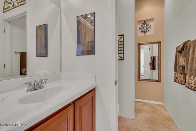 bathroom with tile patterned floors and vanity