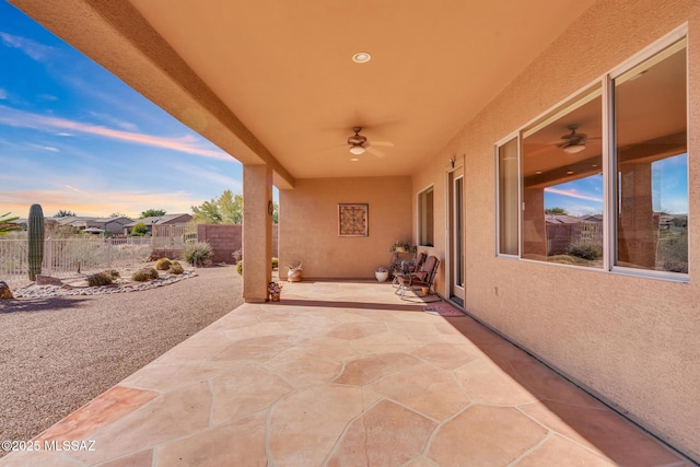 patio terrace at dusk with ceiling fan