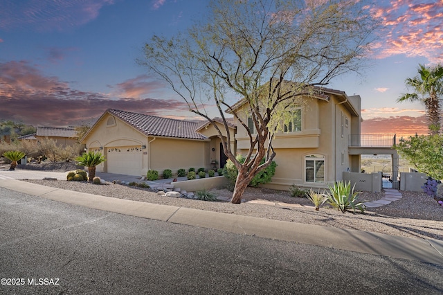 view of front of property with a garage