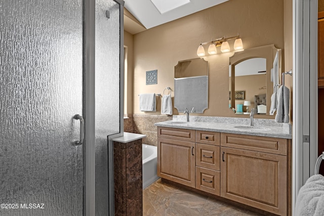 bathroom with vanity and separate shower and tub