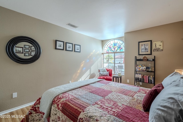 bedroom featuring hardwood / wood-style floors