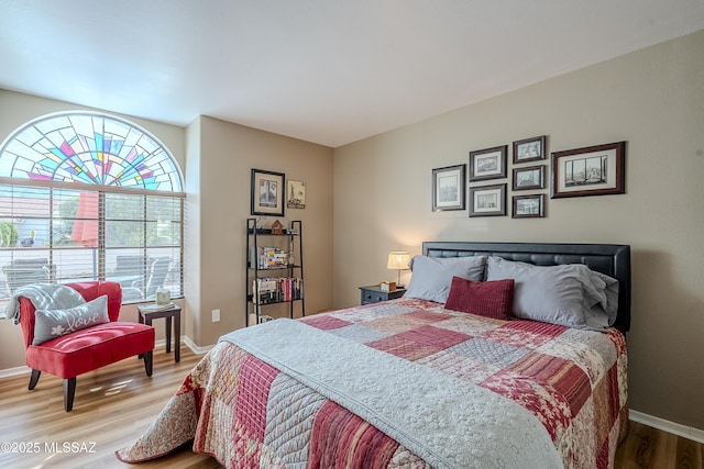 bedroom with wood-type flooring