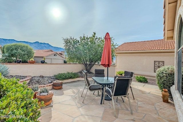 view of patio / terrace featuring a mountain view