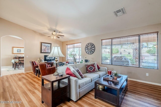 living room with ceiling fan and wood-type flooring