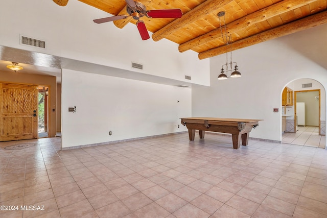 game room with a towering ceiling, ceiling fan, beam ceiling, wooden ceiling, and billiards