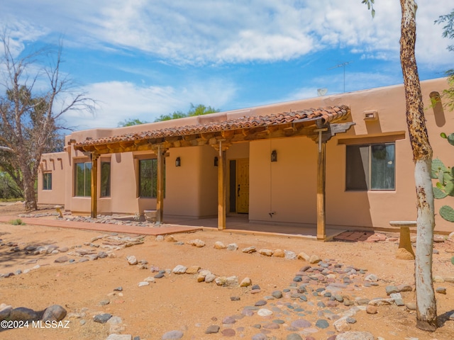 rear view of house featuring a patio