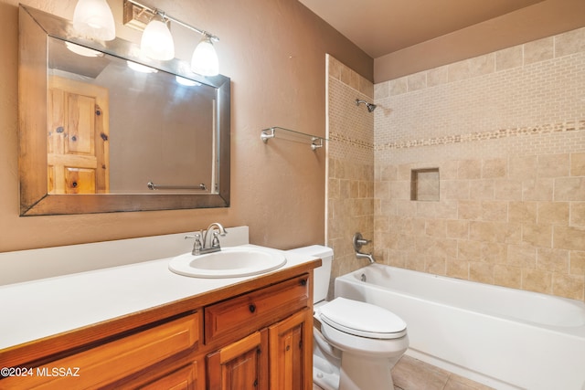 full bathroom featuring vanity, tiled shower / bath combo, and toilet