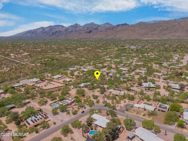 birds eye view of property featuring a mountain view