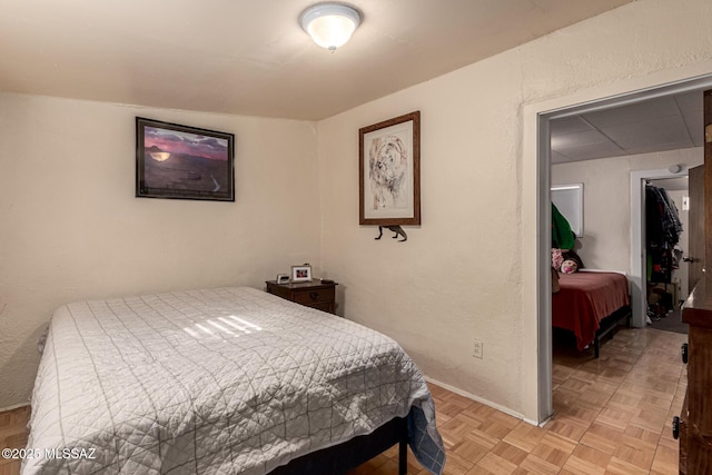 bedroom featuring light parquet floors