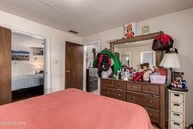 bedroom featuring a drop ceiling