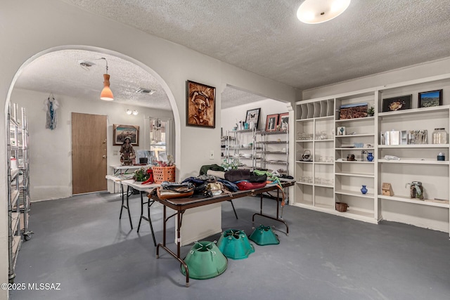 interior space featuring a textured ceiling