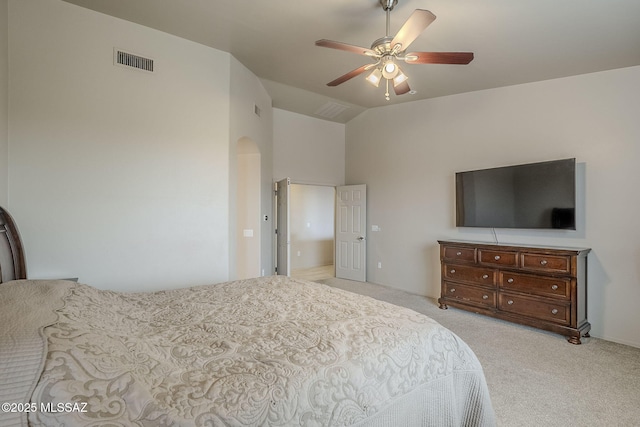 carpeted bedroom featuring ceiling fan and vaulted ceiling