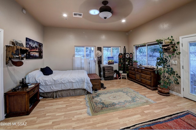 bedroom with access to exterior, light hardwood / wood-style floors, and ceiling fan