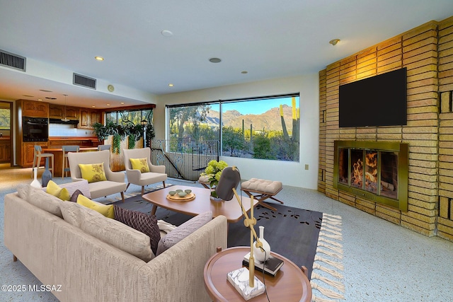 living room featuring a fireplace