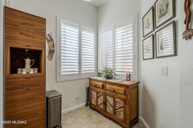 hallway featuring light tile patterned floors