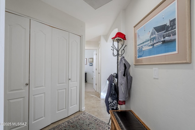 hallway featuring light tile patterned floors