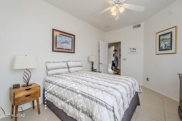 bedroom with ceiling fan and light tile patterned floors