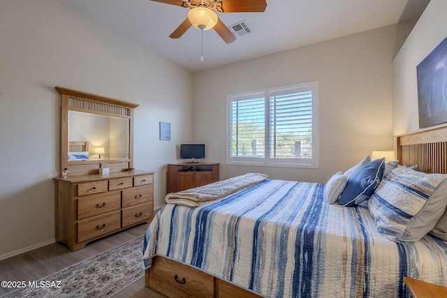 bedroom featuring ceiling fan and light hardwood / wood-style flooring