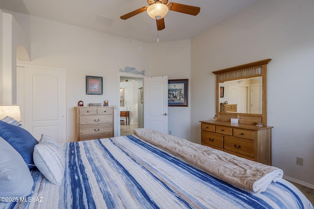 bedroom with hardwood / wood-style flooring and ceiling fan