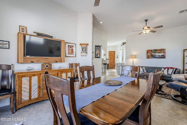 dining space featuring ceiling fan and light tile patterned floors