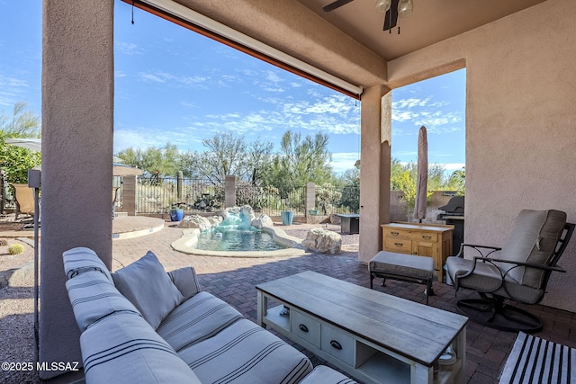 view of patio with a fenced in pool, pool water feature, ceiling fan, and an outdoor hangout area