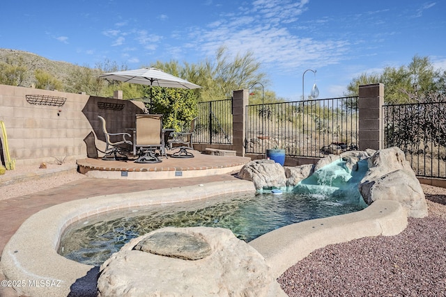 view of swimming pool featuring a patio