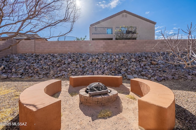 view of patio / terrace featuring a fire pit and a fenced backyard