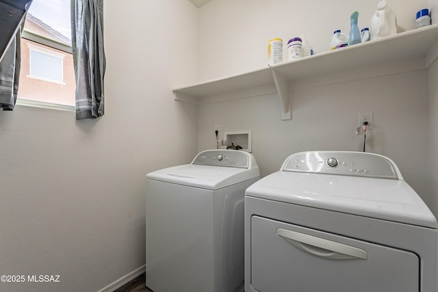 clothes washing area featuring laundry area and independent washer and dryer