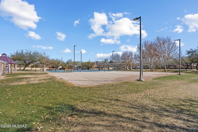 view of community with a yard and volleyball court