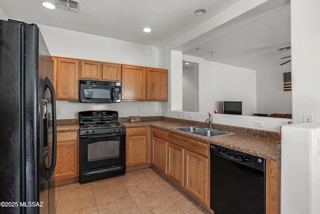 kitchen featuring sink, light tile patterned floors, kitchen peninsula, and black appliances