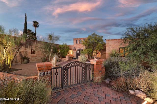 view of gate at dusk