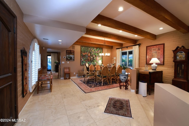 tiled dining area featuring beam ceiling, a chandelier, and brick wall