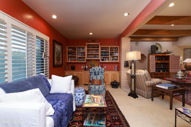 living room featuring beamed ceiling