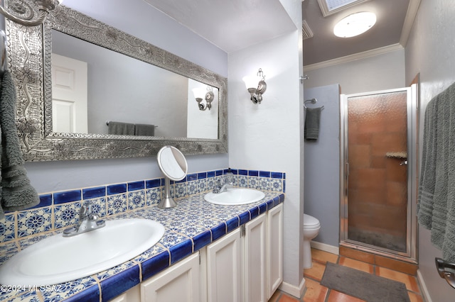 bathroom with vanity, tasteful backsplash, a shower with door, and crown molding