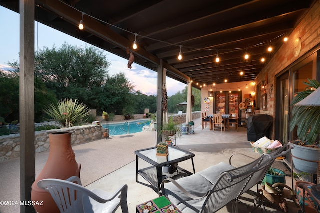 patio terrace at dusk with a grill