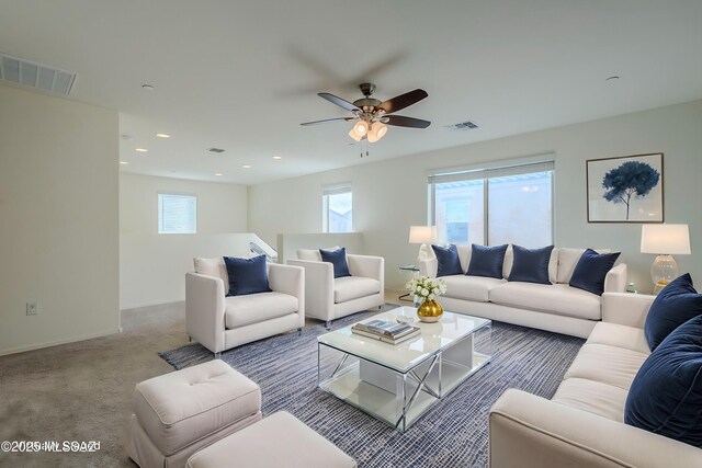 kitchen featuring a sink, visible vents, open floor plan, dishwasher, and an island with sink