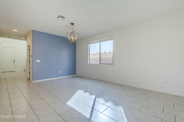 empty room with baseboards, visible vents, a notable chandelier, and light tile patterned flooring