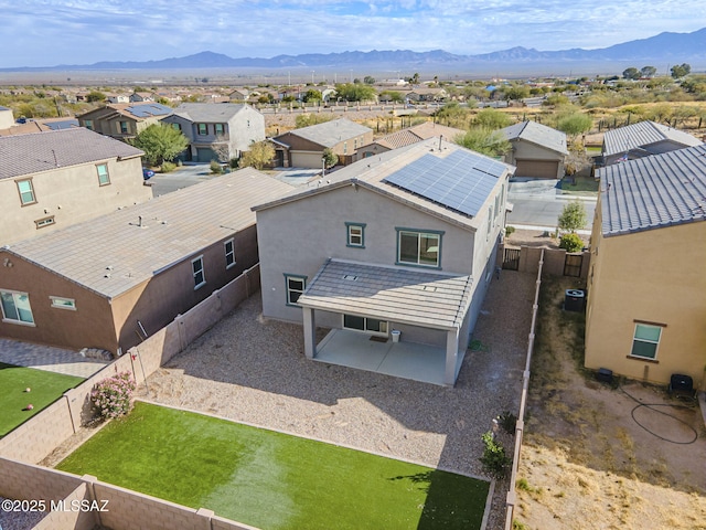 birds eye view of property featuring a mountain view