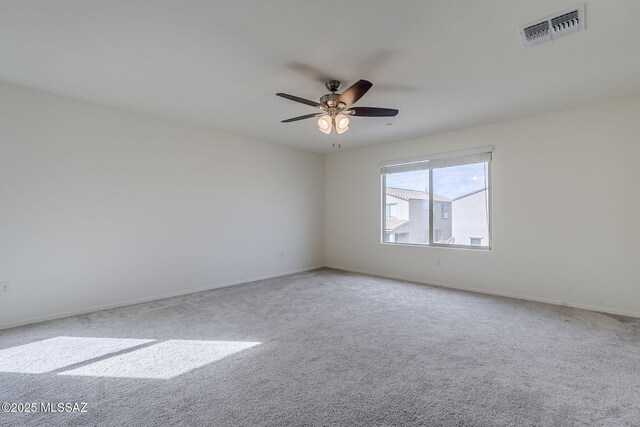 spare room featuring baseboards, visible vents, carpet flooring, and recessed lighting